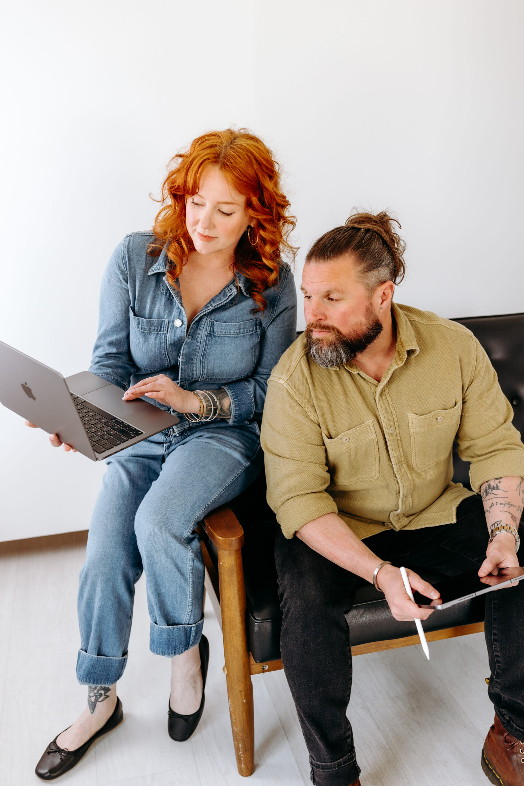 Istari Creative co-founders collaborating in their Bellingham marketing studio